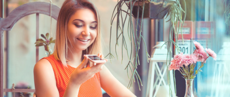 Smiling Girl doing voice search